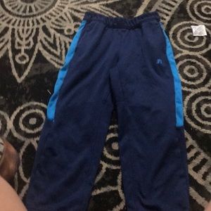 A blue and light blue sweat pants a large in kids.